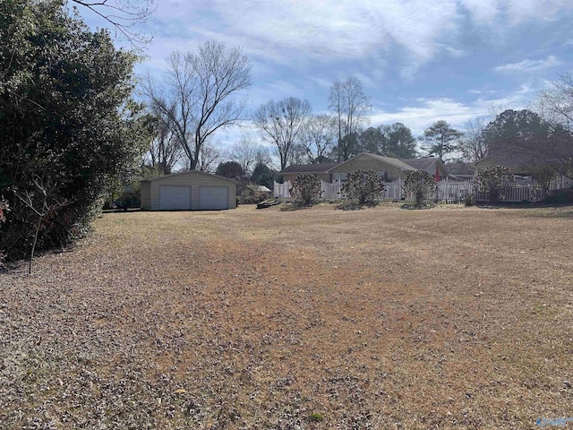 view of yard with an outbuilding and a garage