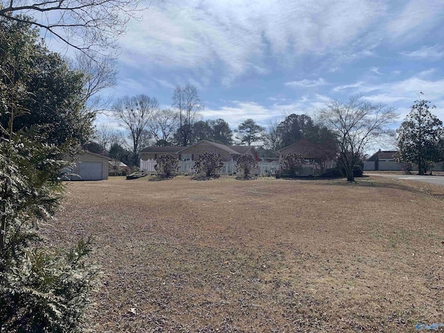 view of yard with a garage and an outdoor structure