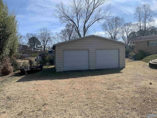 garage featuring a lawn