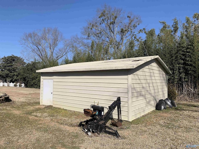 view of outbuilding with a lawn