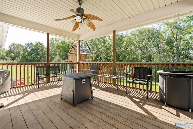 wooden terrace with a ceiling fan