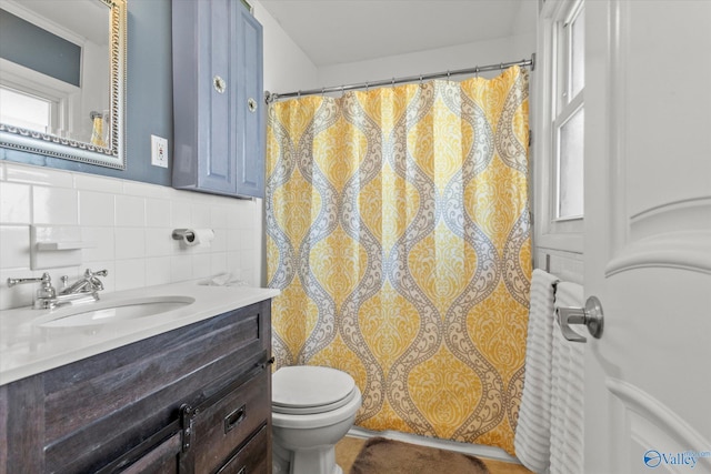 full bathroom featuring vanity, tile walls, curtained shower, and toilet