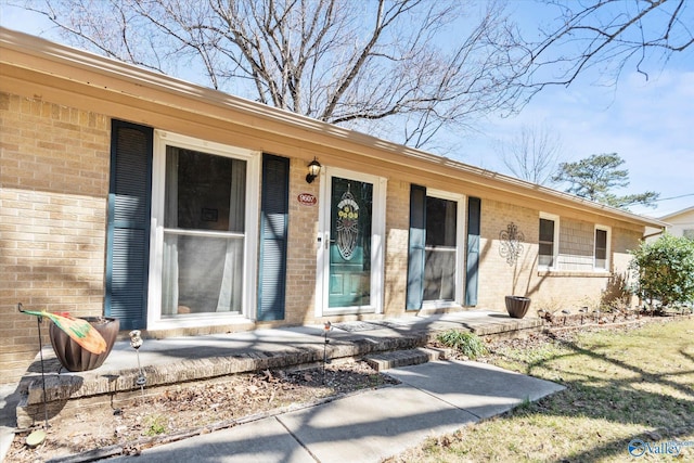 entrance to property with brick siding