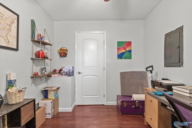 office space with electric panel, baseboards, dark wood-style flooring, and a textured ceiling