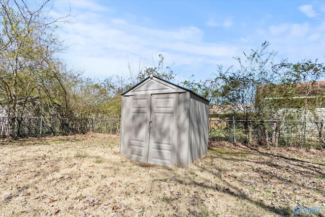 view of shed with a fenced backyard