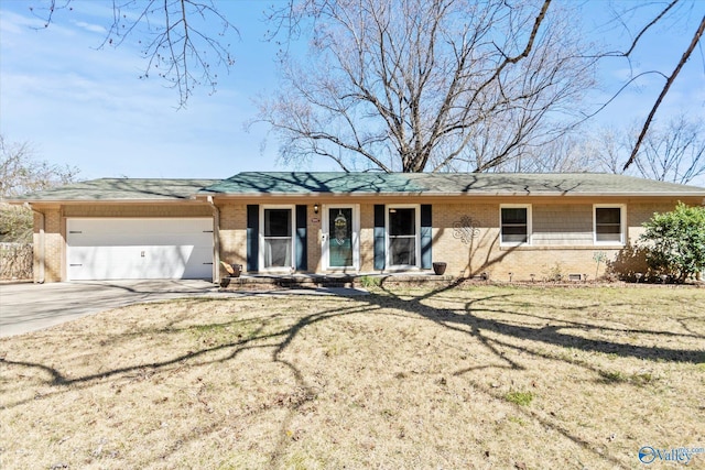 ranch-style home featuring driveway, brick siding, an attached garage, and a front lawn