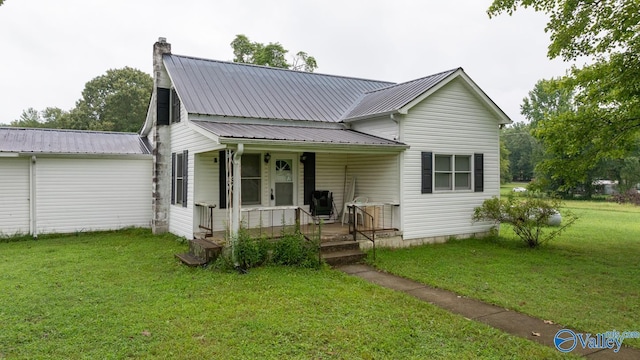 view of front of home featuring a front yard and a porch