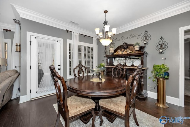 dining room featuring a notable chandelier, dark hardwood / wood-style floors, and ornamental molding