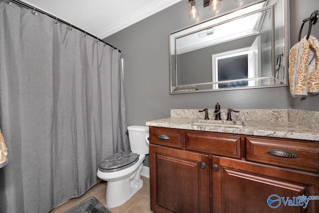 bathroom featuring toilet, vanity, tile patterned floors, and crown molding