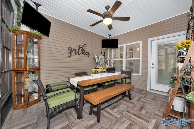 sunroom / solarium with ceiling fan