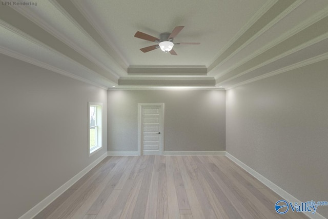 GREENLAND-D Newby Chapel Rd, Athens, AL 35613 - spare room with a tray ceiling, ornamental molding, a ceiling fan, light wood finished floors, and baseboards