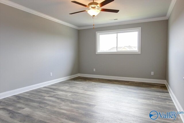 GREENLAND-D Newby Chapel Rd, Athens, AL 35613 - spare room featuring crown molding, ceiling fan, wood finished floors, and baseboards
