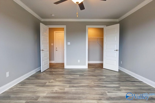 GREENLAND-D Newby Chapel Rd, Athens, AL 35613 - unfurnished bedroom with ornamental molding, baseboards, wood finished floors, a ceiling fan, and a closet