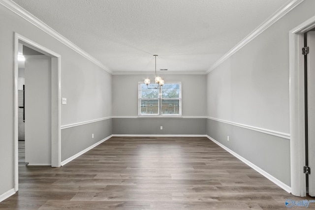 1201 Bailey Cove Cir SE # D, Huntsville, AL 35802 - unfurnished dining area featuring a chandelier, crown molding, wood finished floors, a textured ceiling, and baseboards