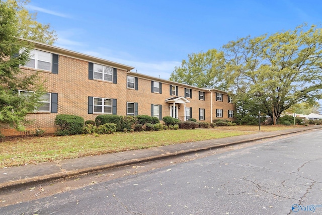 1201 Bailey Cove Cir SE # D, Huntsville, AL 35802 - view of front of house featuring brick siding and a front yard