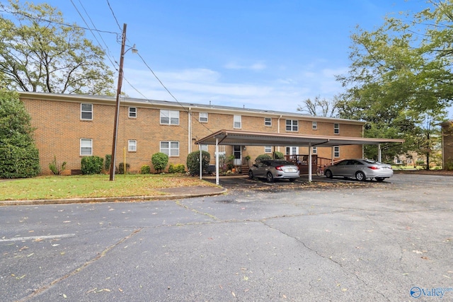 1201 Bailey Cove Cir SE # D, Huntsville, AL 35802 - view of property featuring covered parking