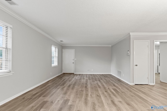 1201 Bailey Cove Cir SE # D, Huntsville, AL 35802 - unfurnished room with light wood-type flooring, crown molding, baseboards, and a textured ceiling