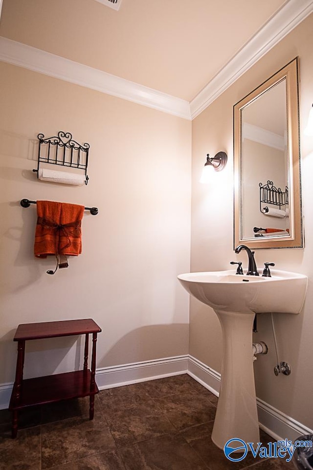 bathroom with crown molding and tile patterned floors