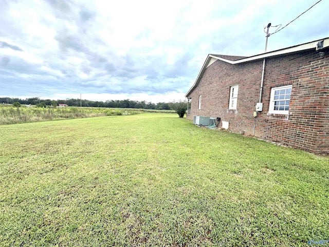 view of yard with central AC