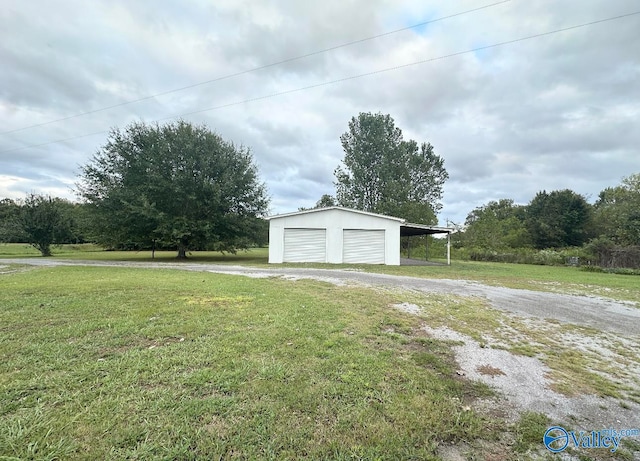 exterior space featuring a lawn and a garage