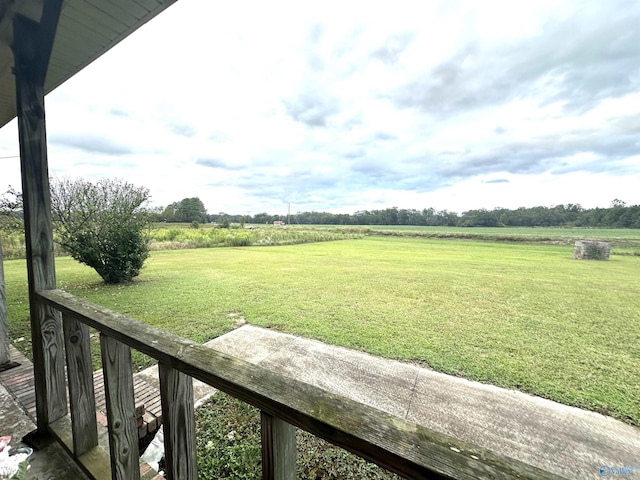 view of yard with a rural view