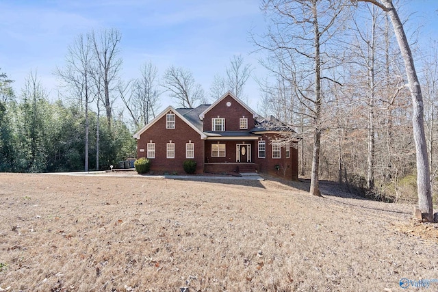 traditional-style home with brick siding