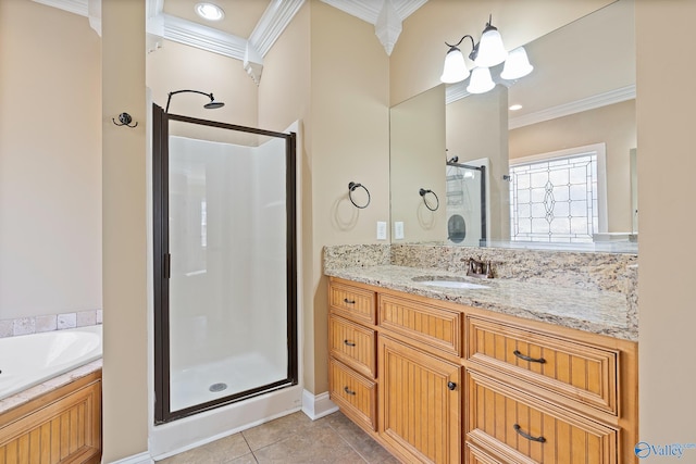 bathroom featuring a garden tub, tile patterned flooring, vanity, ornamental molding, and a shower stall