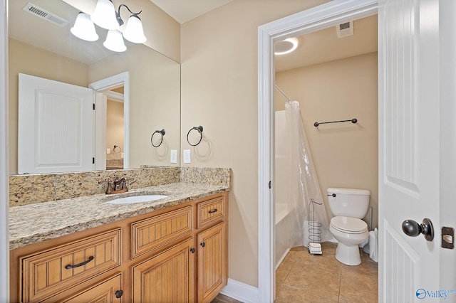 full bathroom with toilet, vanity, visible vents, and tile patterned floors