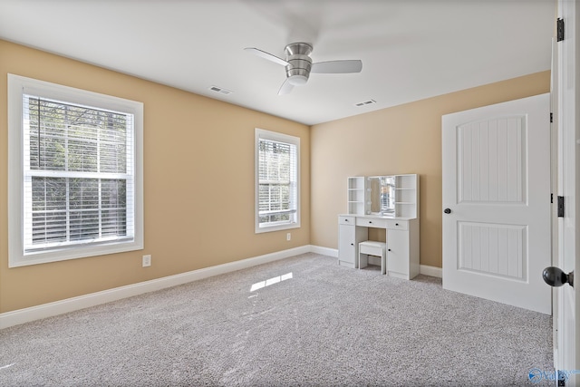 unfurnished bedroom featuring carpet floors, visible vents, and baseboards