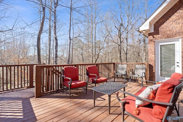 wooden terrace with outdoor lounge area