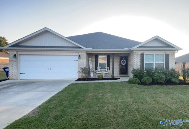 single story home featuring a garage and a front lawn