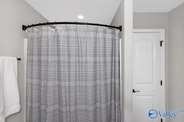 bathroom with a shower with shower curtain