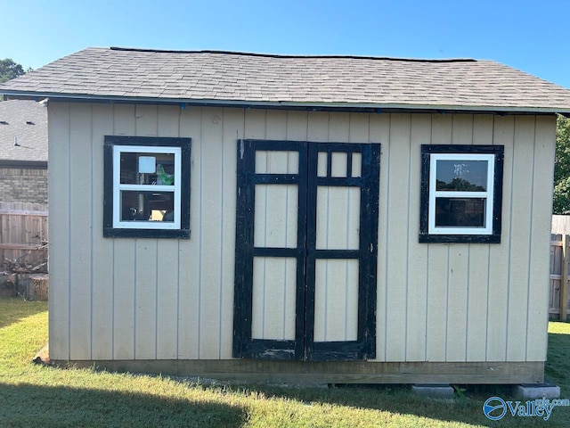 view of outdoor structure with a lawn