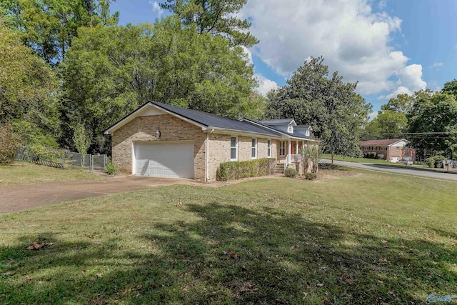 ranch-style house with a garage and a front lawn