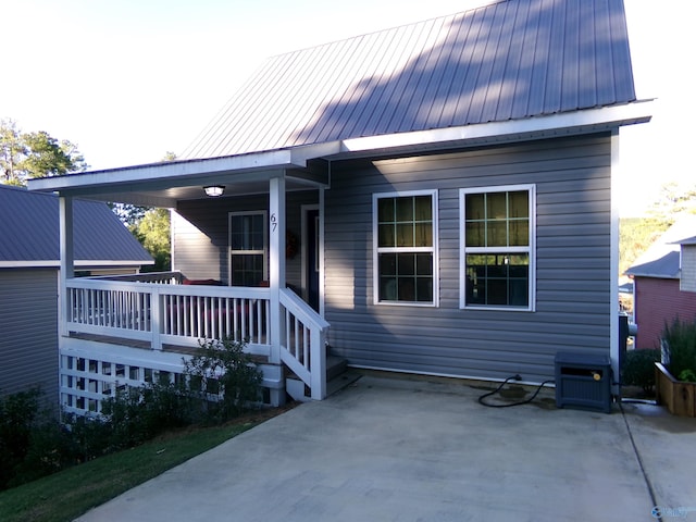 rear view of property with central air condition unit