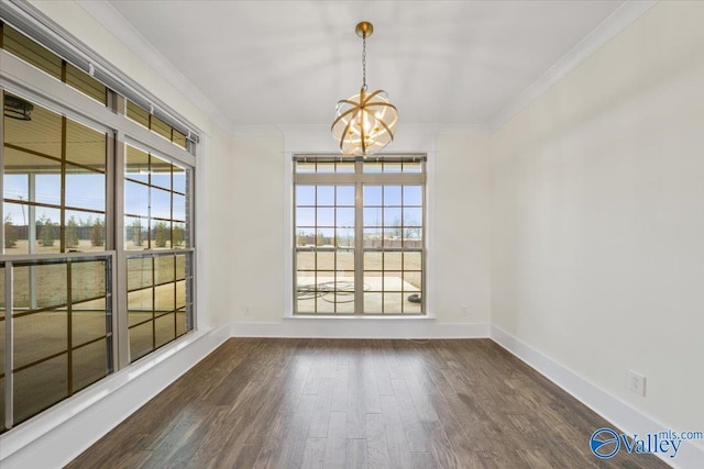 unfurnished dining area with crown molding, a healthy amount of sunlight, and dark wood-type flooring