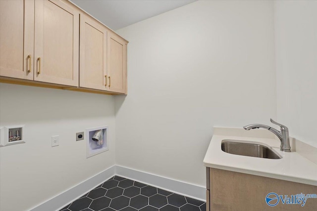 laundry room featuring sink, dark tile patterned floors, electric dryer hookup, hookup for a washing machine, and cabinets