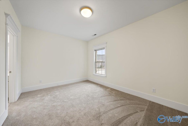 unfurnished room with light carpet