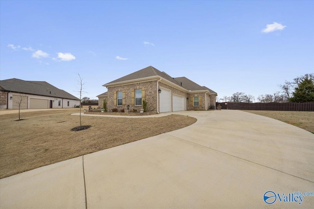 view of front facade featuring a garage and a front lawn