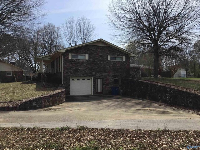 view of side of home with a garage