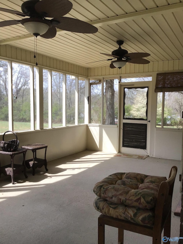 sunroom / solarium with wood ceiling and ceiling fan