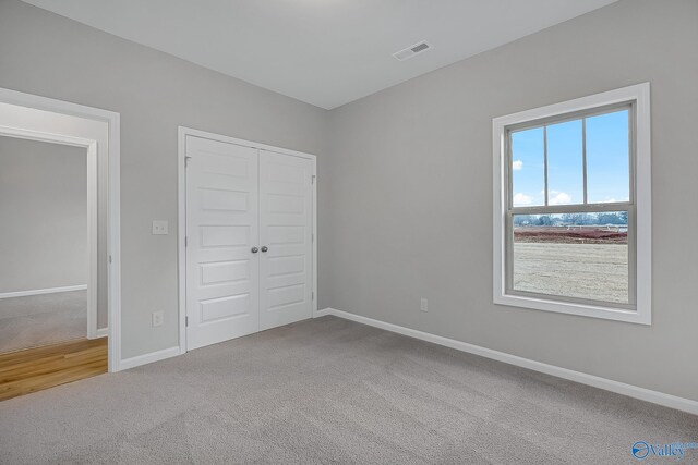 182 Saddle St, New Market, AL 35761 - unfurnished bedroom with a closet and carpet