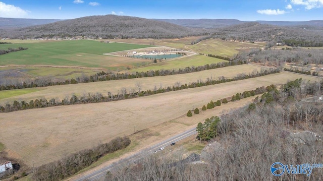 drone / aerial view featuring a rural view and a mountain view