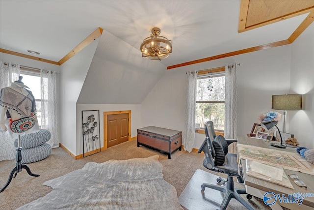 carpeted home office featuring baseboards, vaulted ceiling, and crown molding