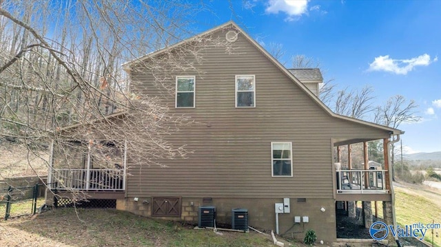 view of property exterior with central AC unit