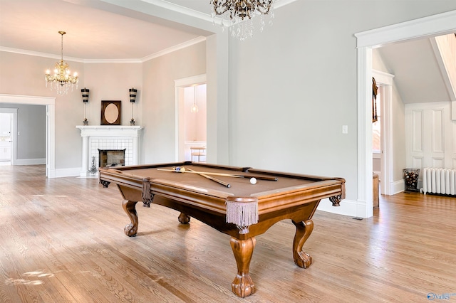 605 Ferry St, Decatur, AL 35601 - playroom with radiator heating unit, a chandelier, light wood-style floors, billiards, and baseboards