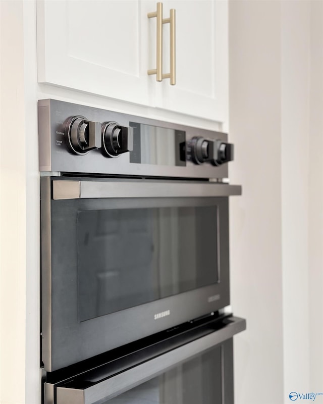 605 Ferry St, Decatur, AL 35601 - kitchen view of white cabinetry and stainless steel oven