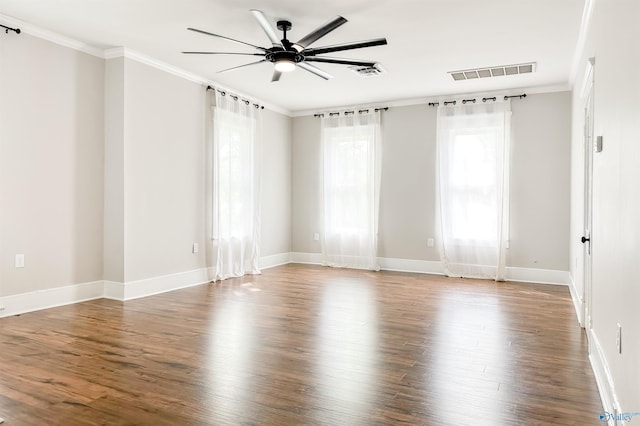 605 Ferry St, Decatur, AL 35601 - empty room with wood finished floors, plenty of natural light, crown molding, ceiling fan, and baseboards