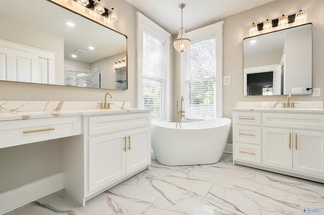 605 Ferry St, Decatur, AL 35601 - full bath with marble finish floors, a freestanding bath, two vanities, walk in shower, and recessed lighting