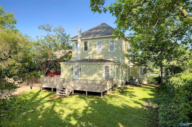 605 Ferry St, Decatur, AL 35601 - back of property featuring a deck, a chimney, and roof with shingles